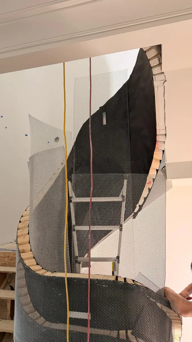 Smooth curved plaster wall finished by a professional drywall and plastering crew in a Massachusetts home
